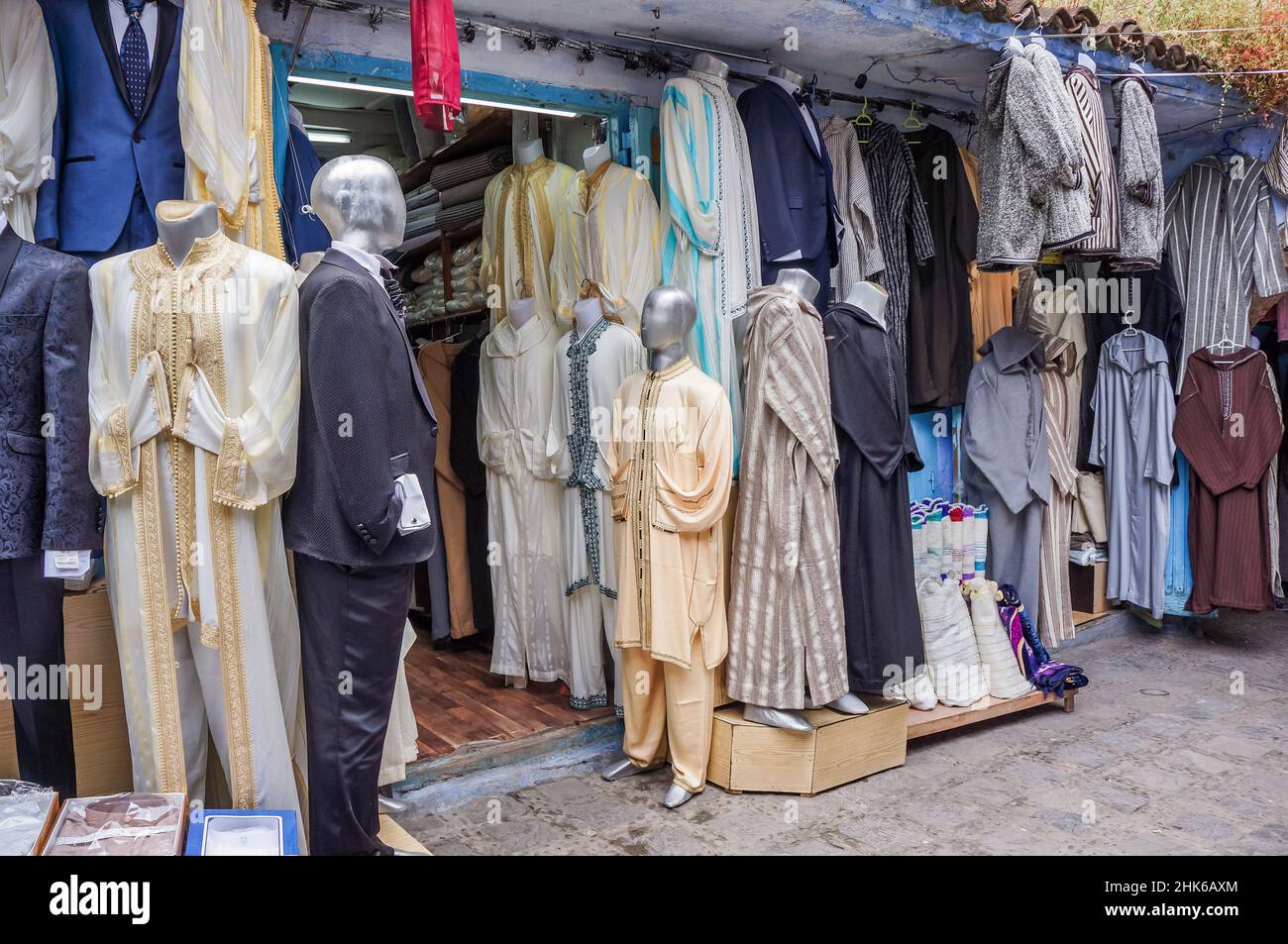 Front side of a traditional Moroccan shop with mannequins dressed in men clothes Stock Photo
