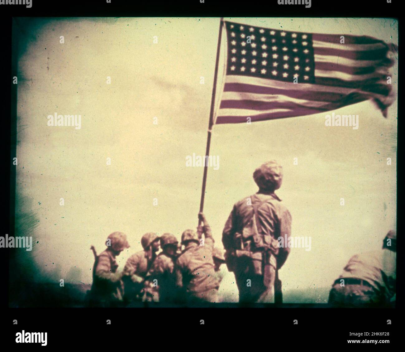 February 23, 1945, Iwo Jima - A still from the film shot by Marine photographer Bill Genaust of the flag-raising atop Mt. Suribachi. Stock Photo