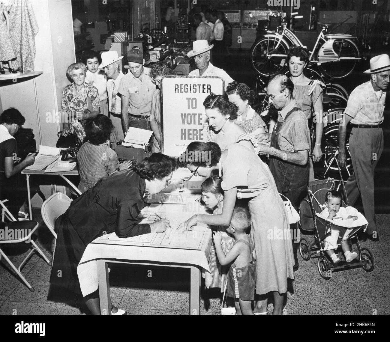 Citizens of Tucson, AZ line up at a registration booth at Sears Roebuck store to register to vote in the 1950 general election,Tucson, AZ, 1953. Stock Photo