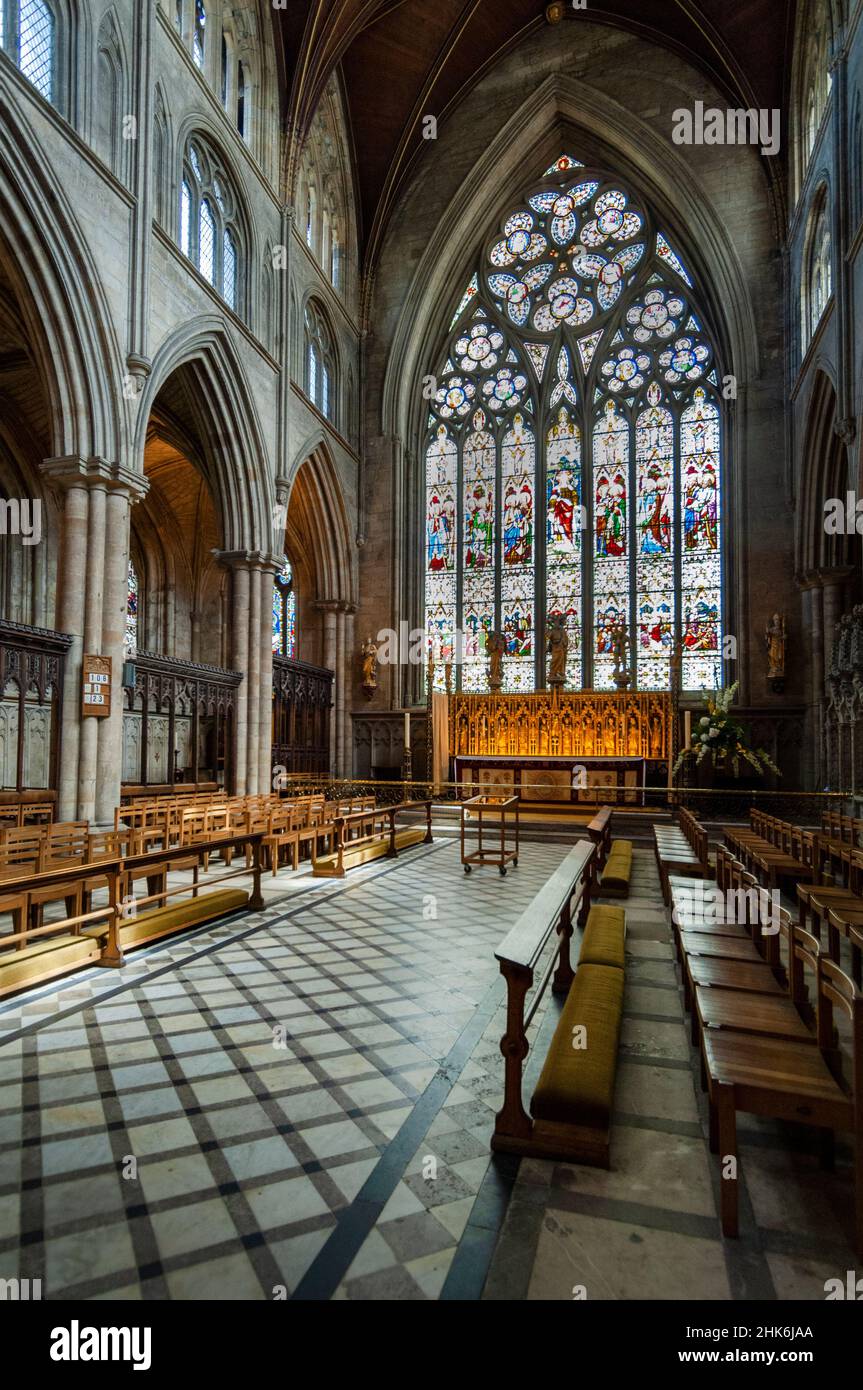 The Cathedral Church of St Peter and St Wilfrid - Ripon Cathedral - North Yorkshire,- interior view of the choir stalls, altar and east window Stock Photo