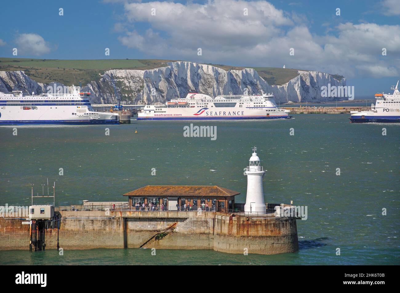 The White Cliffs of Dover and lighthouse from sea, Dover, Kent, England, United Kingdom Stock Photo