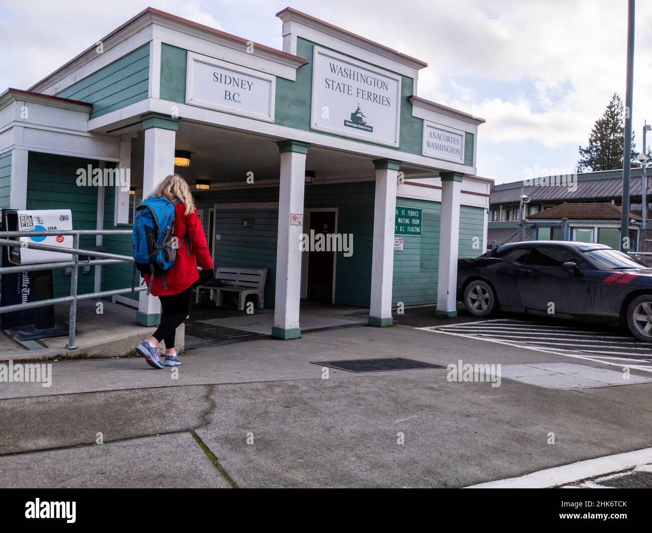 Friday Harbor, WA USA - circa November 2021: View of people lined up, waiting to board the Tillkum Washington State Ferry on a sunny day. Stock Photo