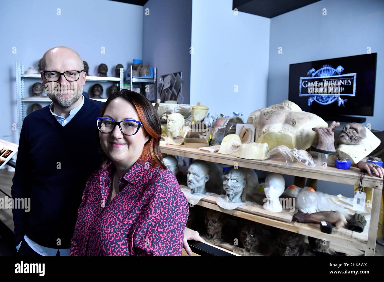 Barrie and Sarah Gower, who worked as prosthetics designers on TV show Game of Thrones, pose for a photograph in the prosthetics room during the media preview day for the opening of the new Game of Thrones studio tour at Linen Mill Studios in Banbridge, Northern Ireland, February 2, 2022. REUTERS/Clodagh Kilcoyne Stock Photo