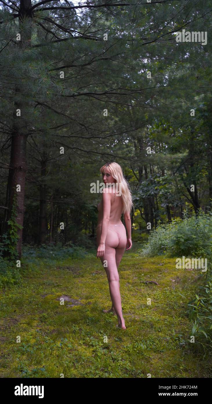 Nude model Gardening Stock Photo
