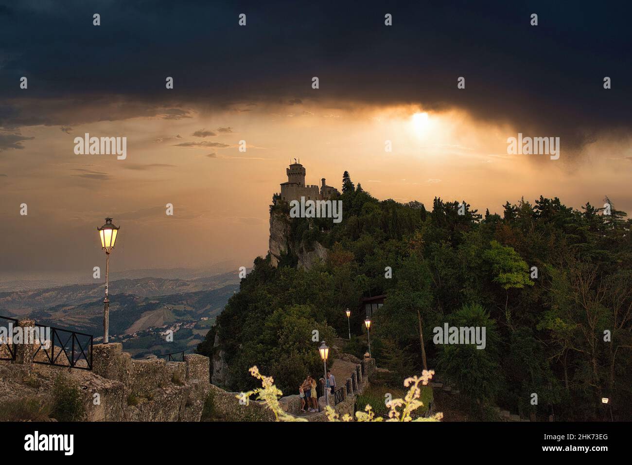 A Magnificent sunset that illuminates Rocca della Guaita, the most famous and ancient castle fortress in the Republic of San Marino Italy Stock Photo