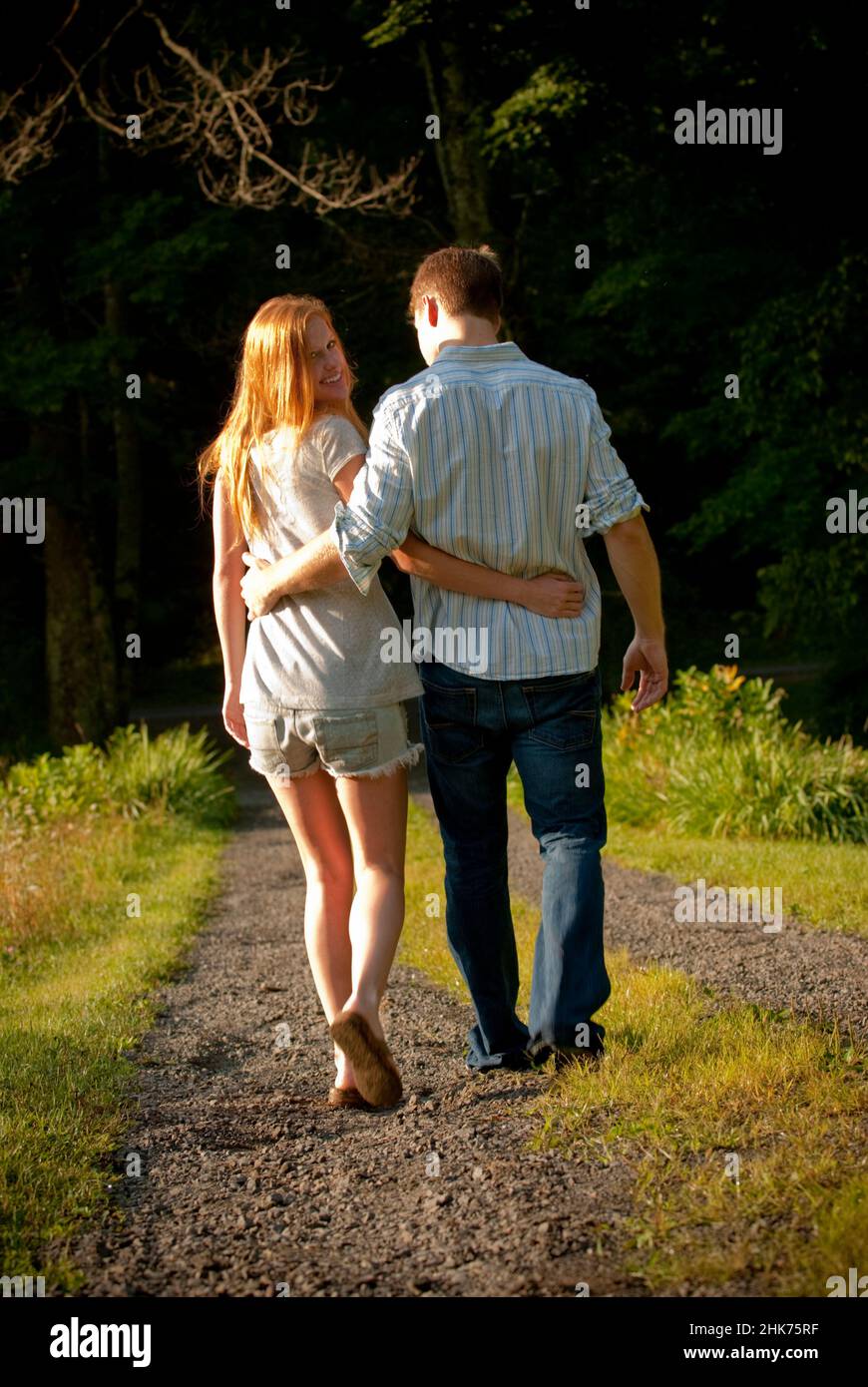 Couple walking arms around other hi-res stock photography and images ...