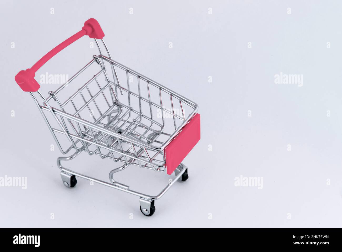 pink shopping cart completely empty Stock Photo
