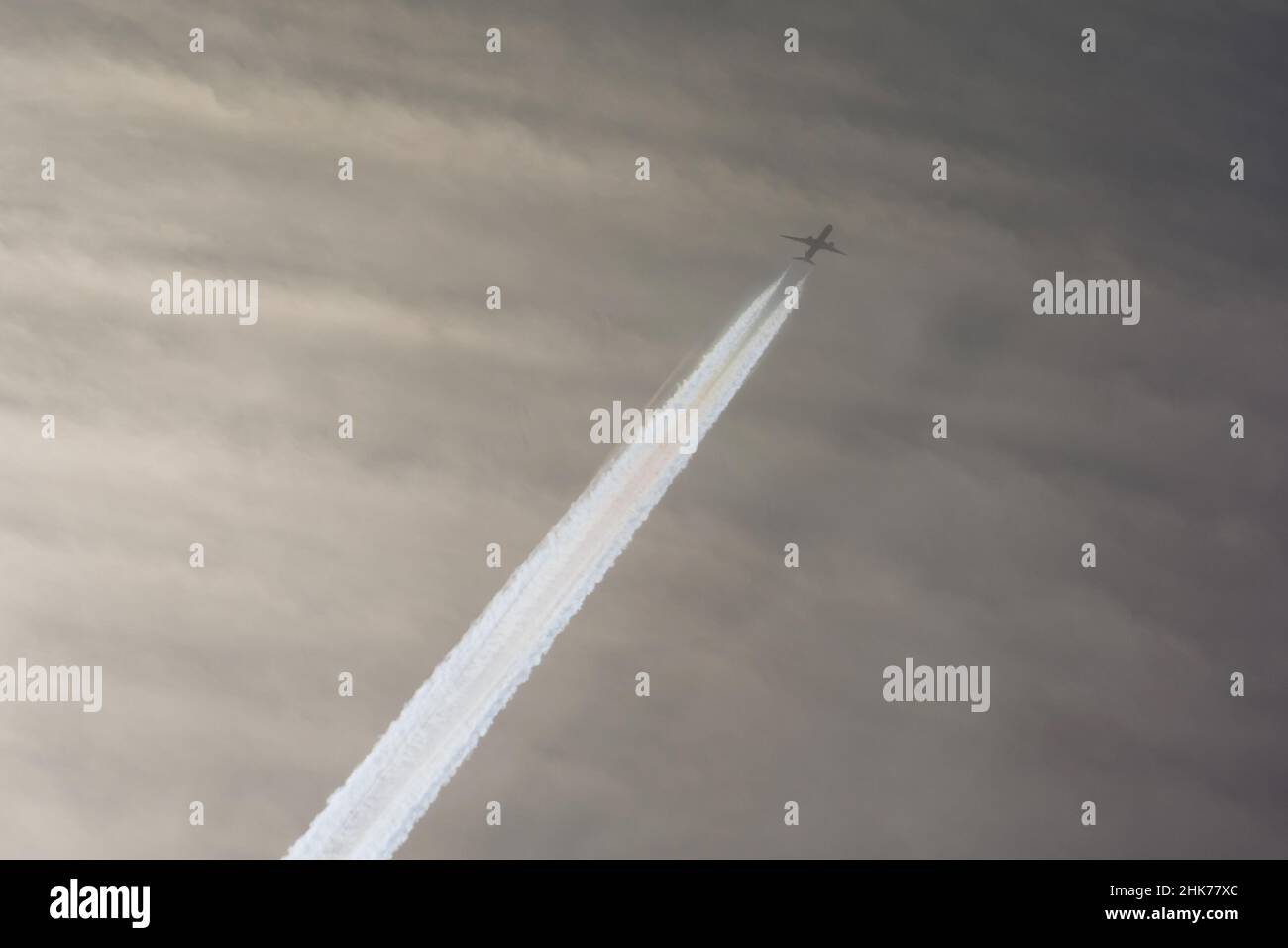 Airplane in sky aviation airport contrail clouds Stock Photo - Alamy