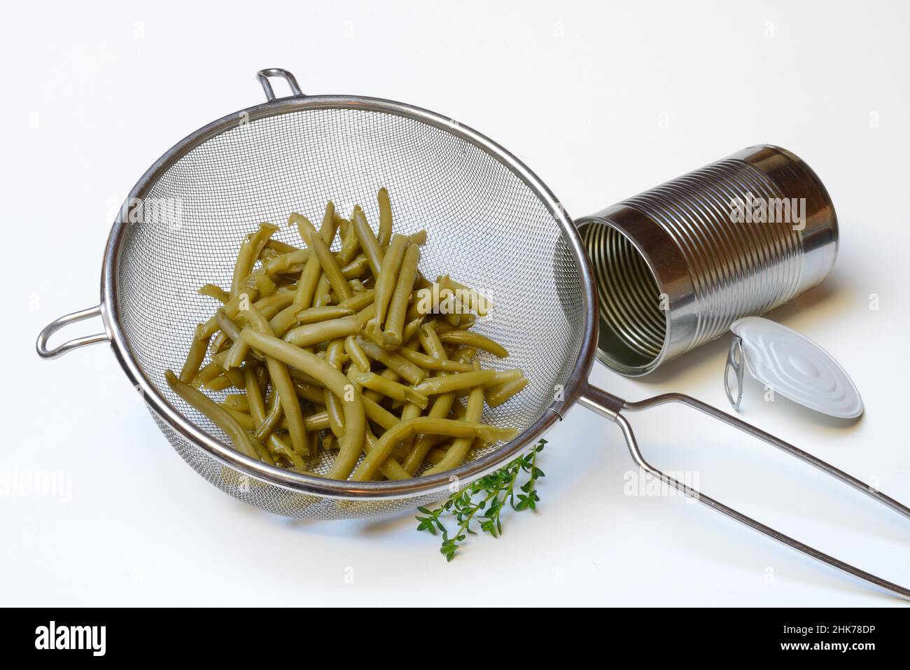 Green beans and savory in sieve and tin, Common bean Stock Photo Alamy