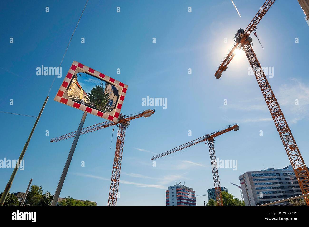 Cranes and concave mirrors at construction site on Orleanstr. Munich, Bavaria, Germany Stock Photo