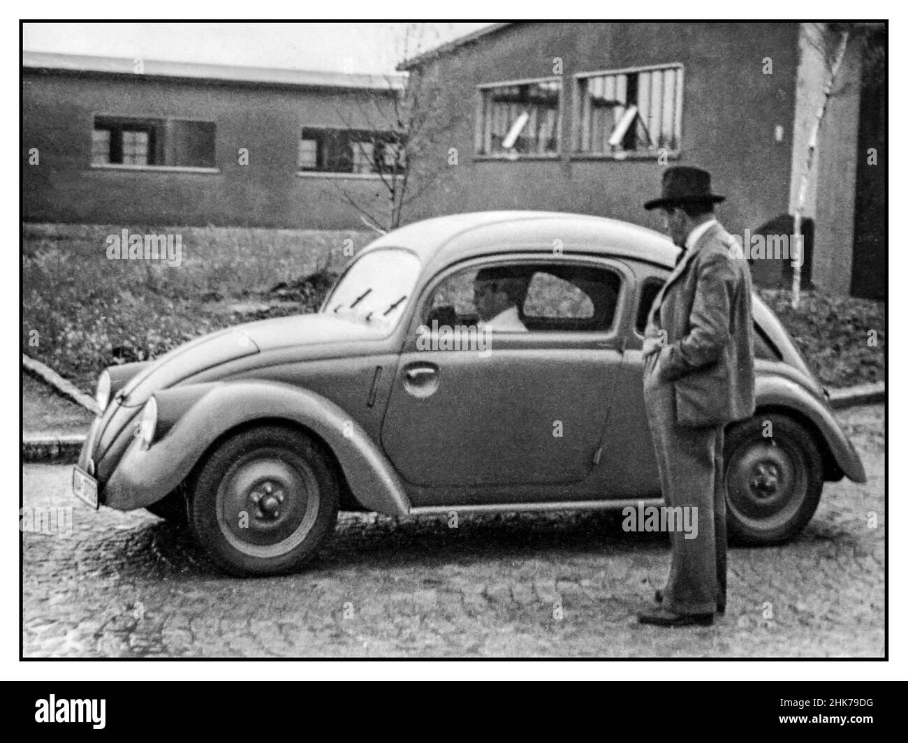 Ferdinand Porsche designer with a KDF Wagen VW Volkswagen peoples car prototype model w 30 1937 Nazi Germany Stock Photo