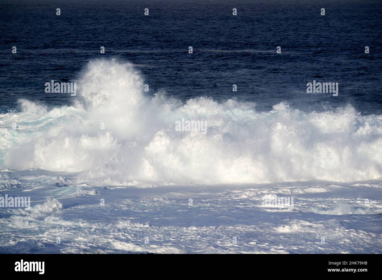 foam and spray from powerful atlantic waves breaking near western shoreline of Punta Pechiguera playa blanca Lanzarote Canary Islands Spain Stock Photo