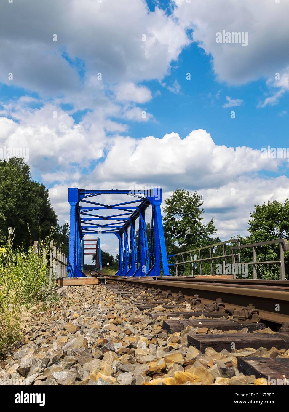 Blue steel bridge along the railway line, Berlin, Germany Stock Photo