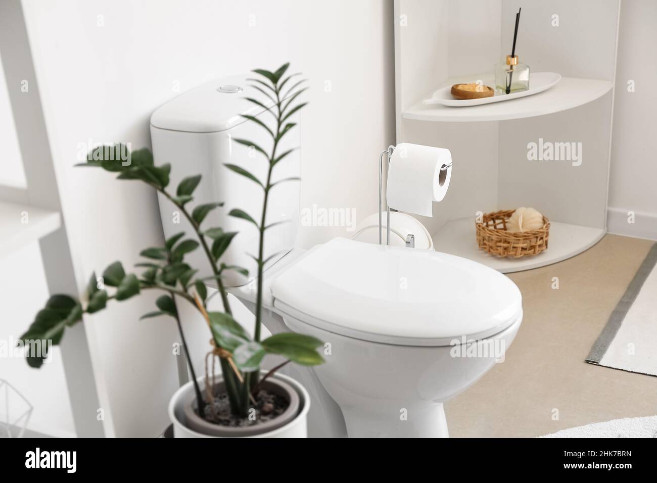 Interior of stylish modern restroom with toilet bowl Stock Photo - Alamy