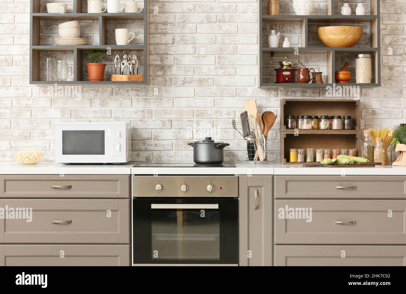 Interior of kitchen with modern microwave oven and kitchenware Stock ...