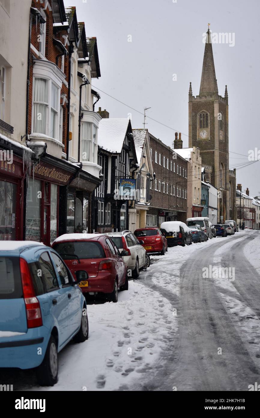 St Nicholas Church as seen from a snow covered Church Street in the Historic Town of Harwich. Harwich & Dovercourt, North Essex, UK Stock Photo