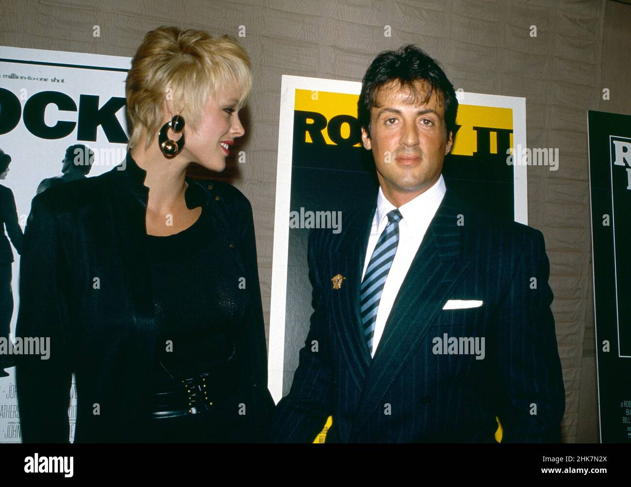 USA. Brigitte Nielsen and Sylvester Stallone at an event. Circa 1980s. Ref:  LMK30-33626-130312 Borsari/Landmark Media WWW.LMKMEDIA.COM Tel: +44(0)20  7033 3830 NO WEBSITE USE WITHOUT PRIOR AGREEMENT OR ARRANGEMENT Stock Photo  - Alamy