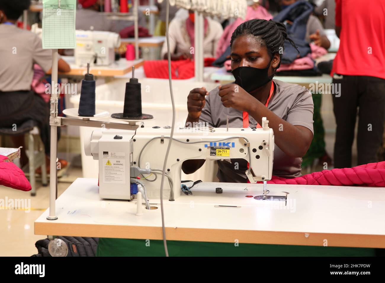 Kigali, Rwanda. 28th Jan, 2022. A Rwandan woman works in Chinese ...