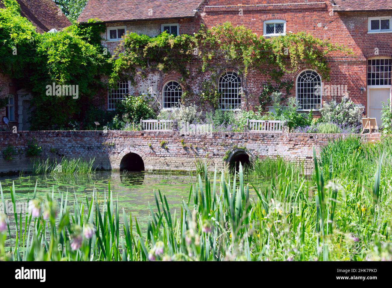 Archways under the pathway lead into the pond, part of the River Stour at Flatford Mill, Operated by the National Trust in Suffolk, England. Stock Photo