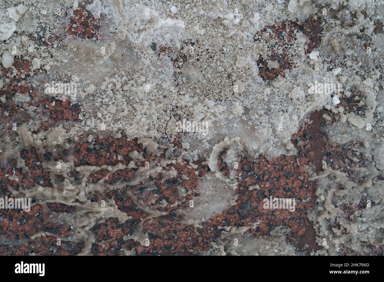 Above view of reagent or technical salt used for melting ice and snow ...