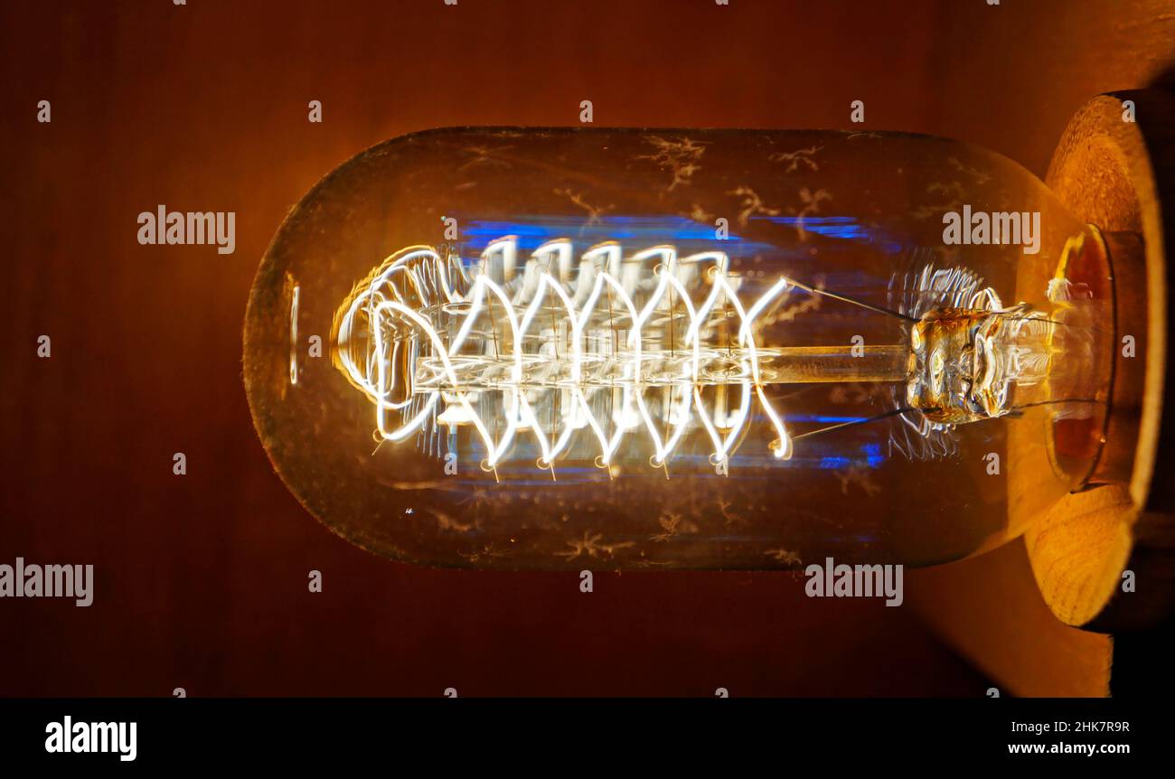 Closeup of a glowing incandescent light bulb filaments Stock Photo Alamy