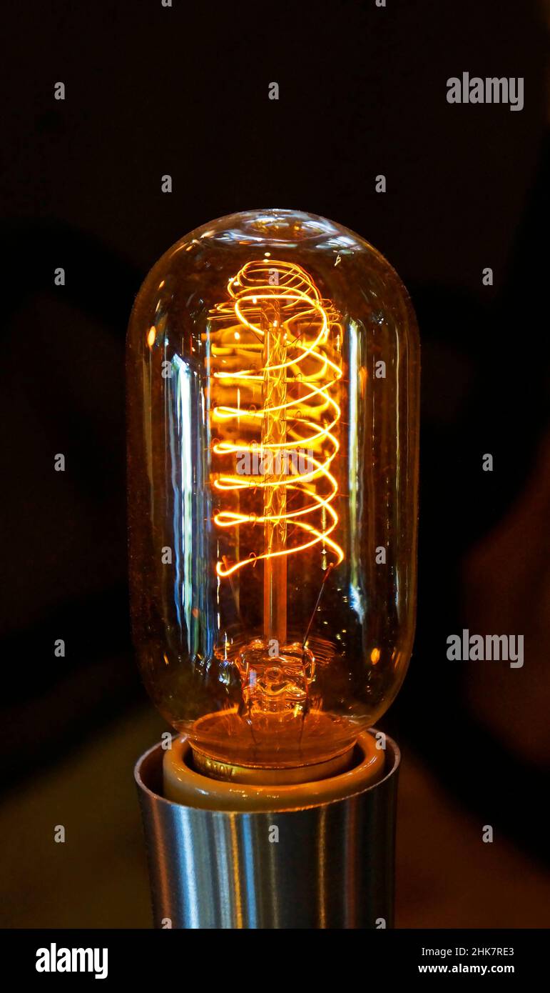 Closeup of a glowing incandescent light bulb filaments Stock Photo Alamy