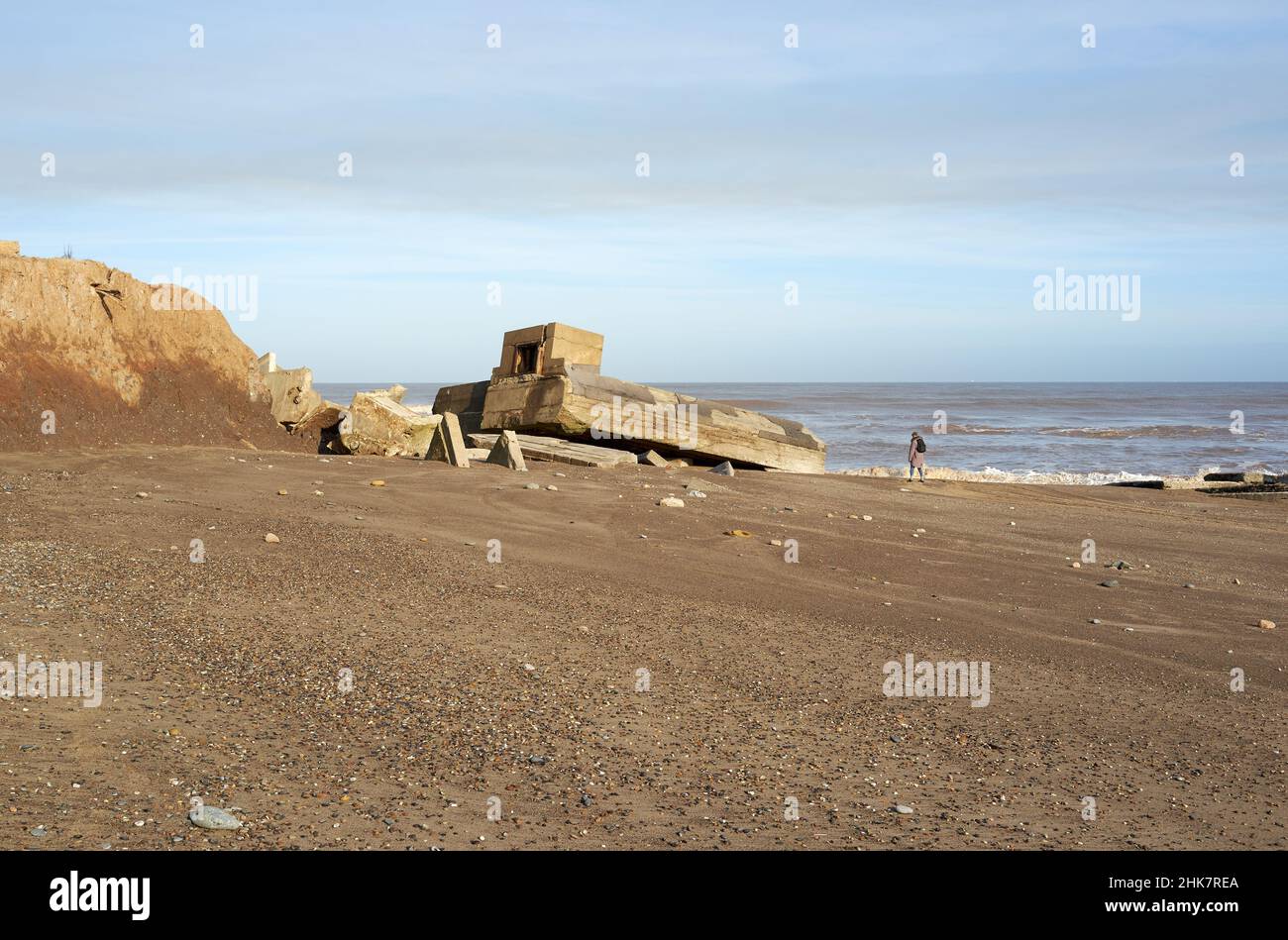 Collapsed WW2 bunker on a beach Stock Photo