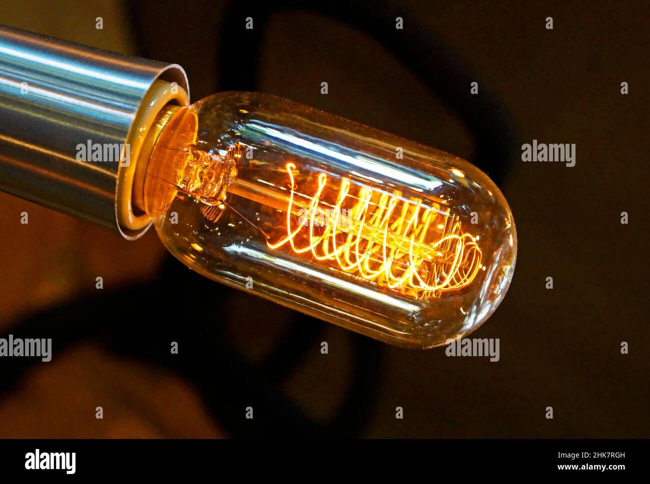 Closeup of a glowing incandescent light bulb filaments Stock Photo Alamy