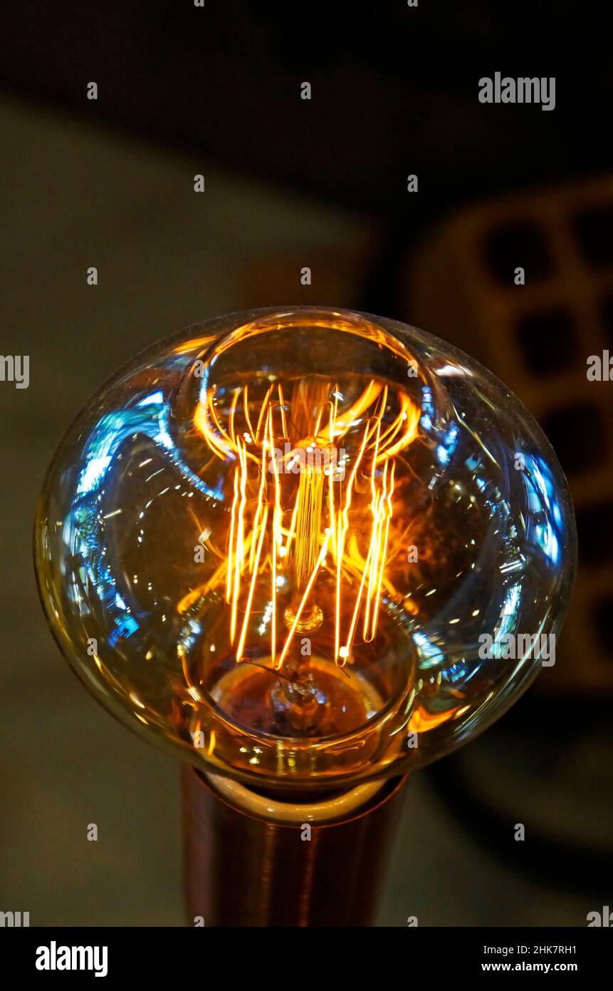 Closeup of a glowing incandescent light bulb filaments Stock Photo Alamy