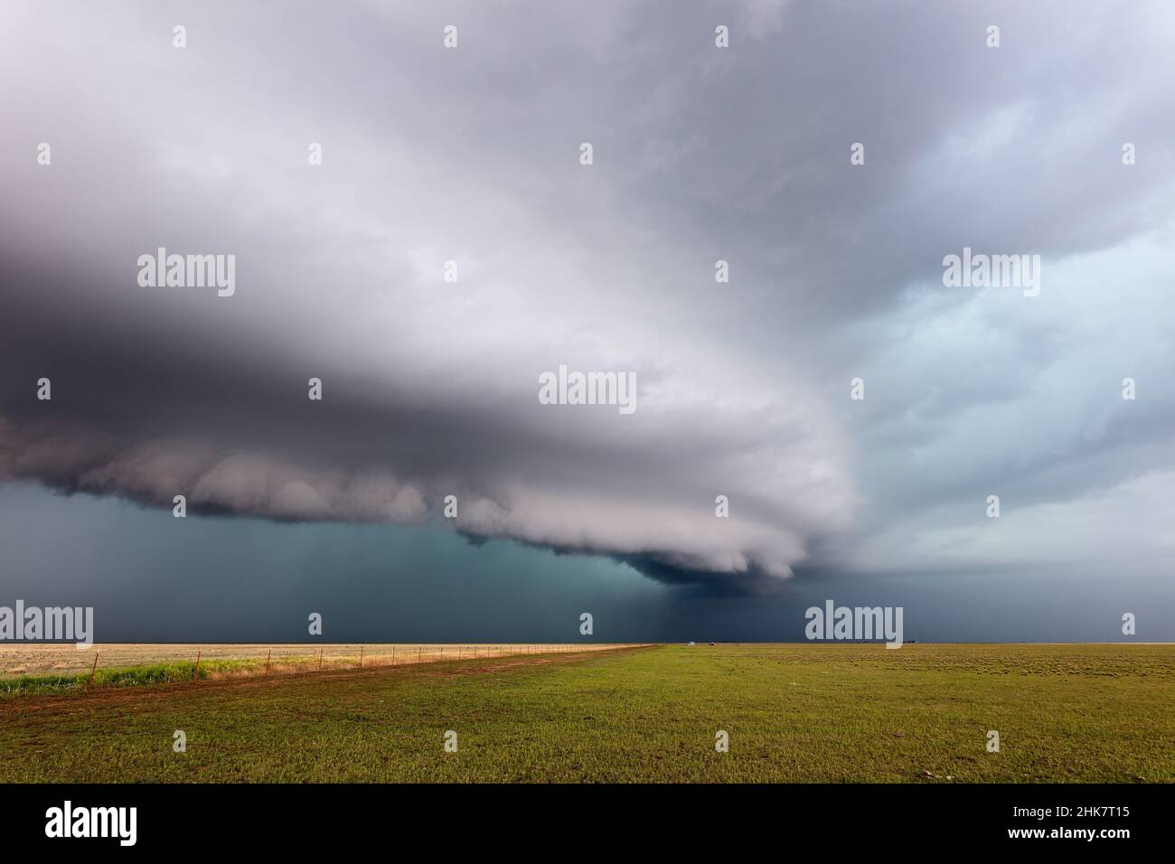 Dramatic shelf cloud (arcus) approaching ahead of a storm over a field near Vega, Texas Stock Photo