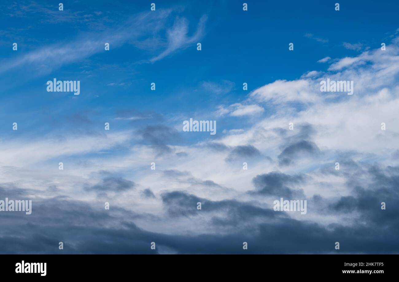 Blue sky shrouded in gray dark clouds Stock Photo