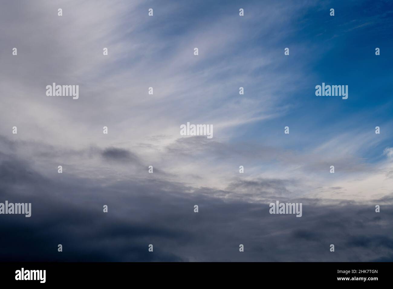 Blue sky shrouded in gray dark clouds Stock Photo
