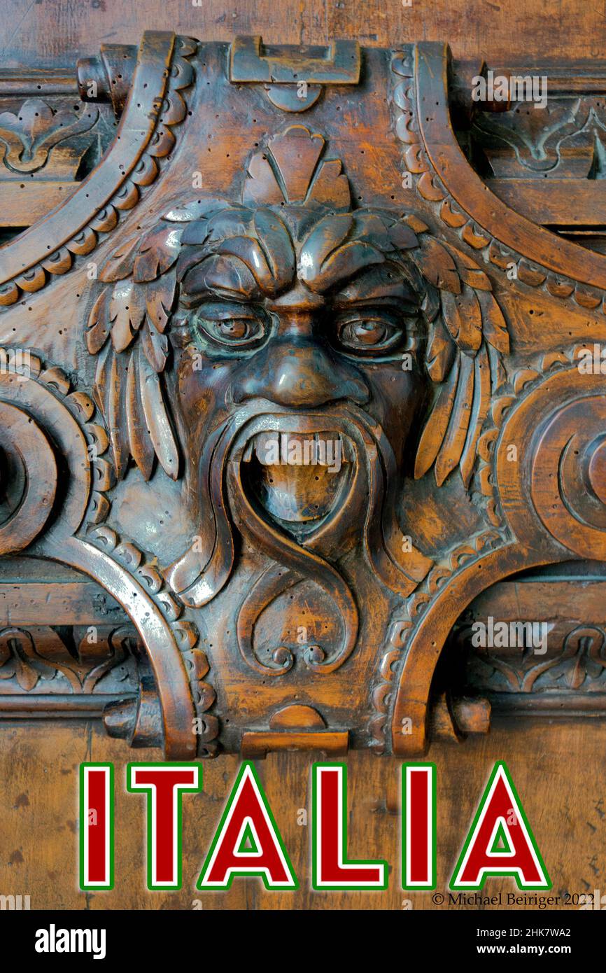 Poster of carved gargoyle in wooden door in Doge's palace, Venice, 2017. Stock Photo