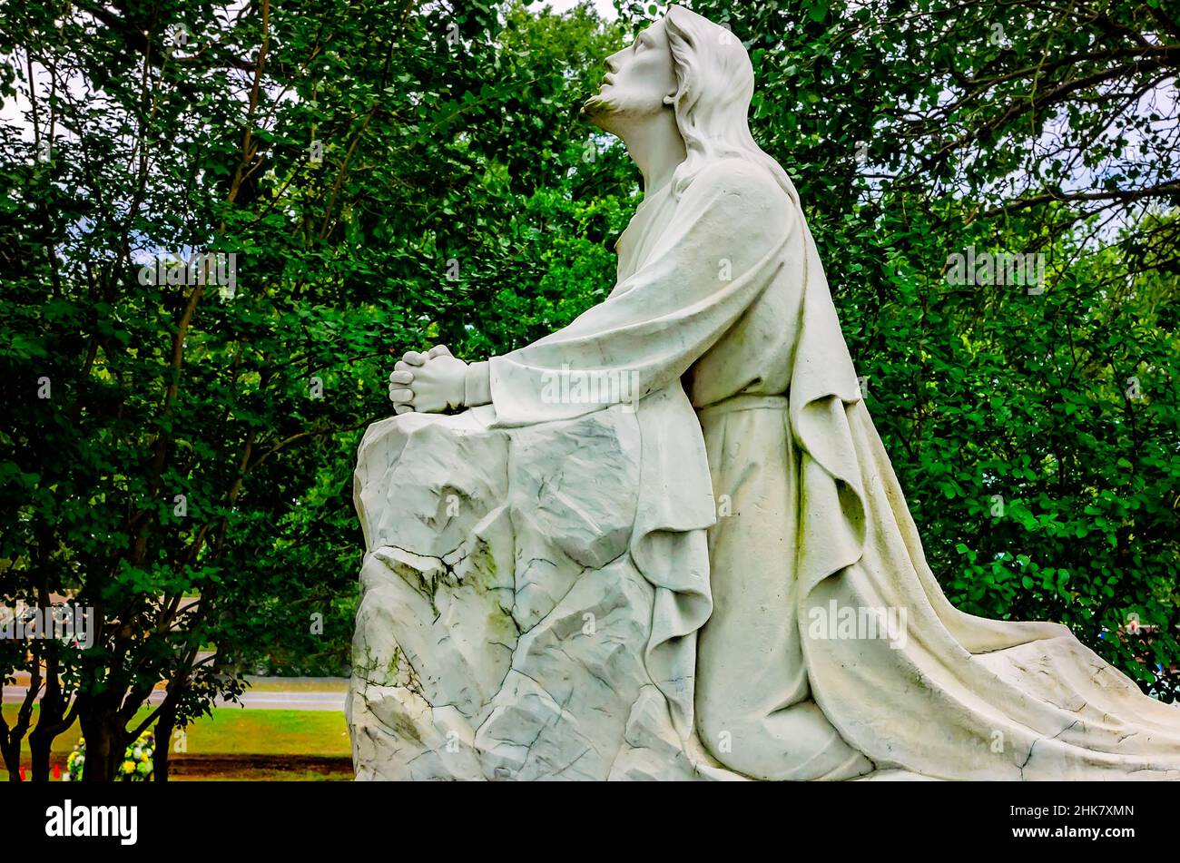 A statue of Jesus in the Garden of Gethsemane is pictured at Memory Hill Gardens, Aug. 24, 2019, in Tuscaloosa, Alabama. Stock Photo