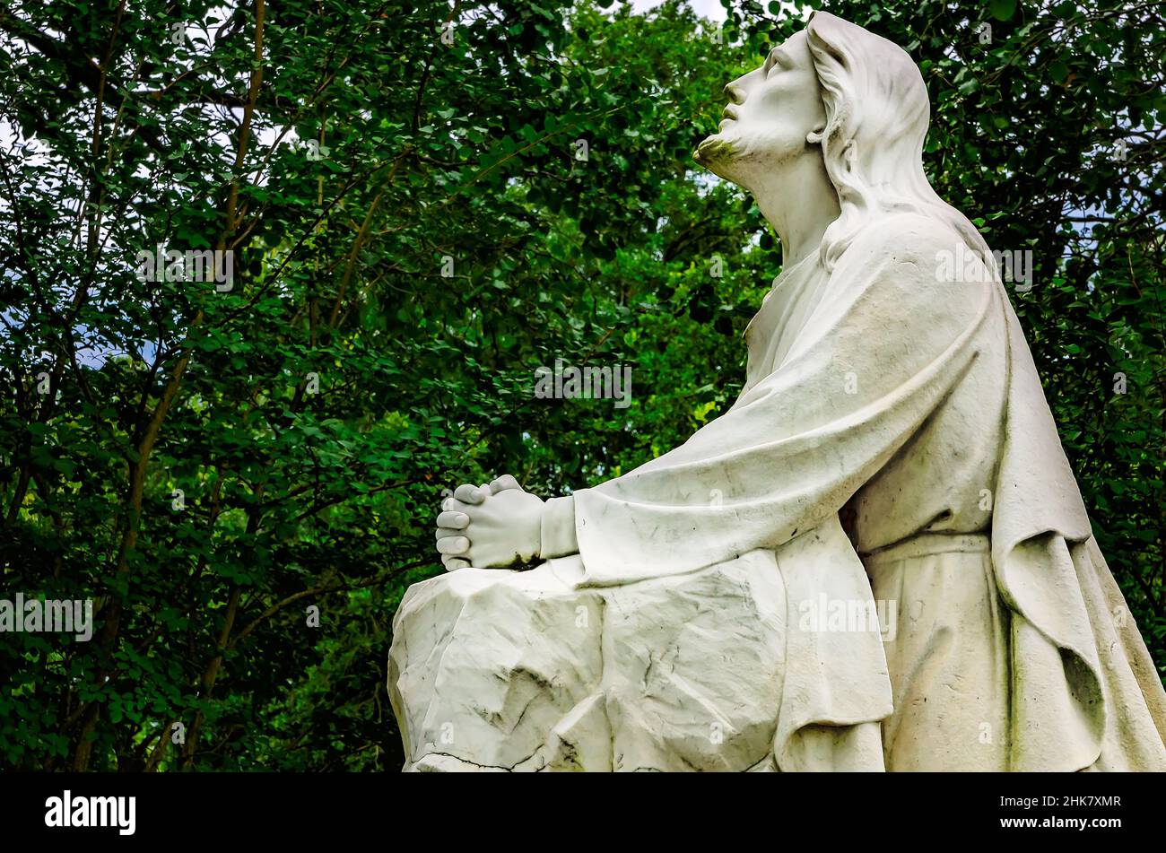 A statue of Jesus in the Garden of Gethsemane is pictured at Memory Hill Gardens, Aug. 24, 2019, in Tuscaloosa, Alabama. Stock Photo