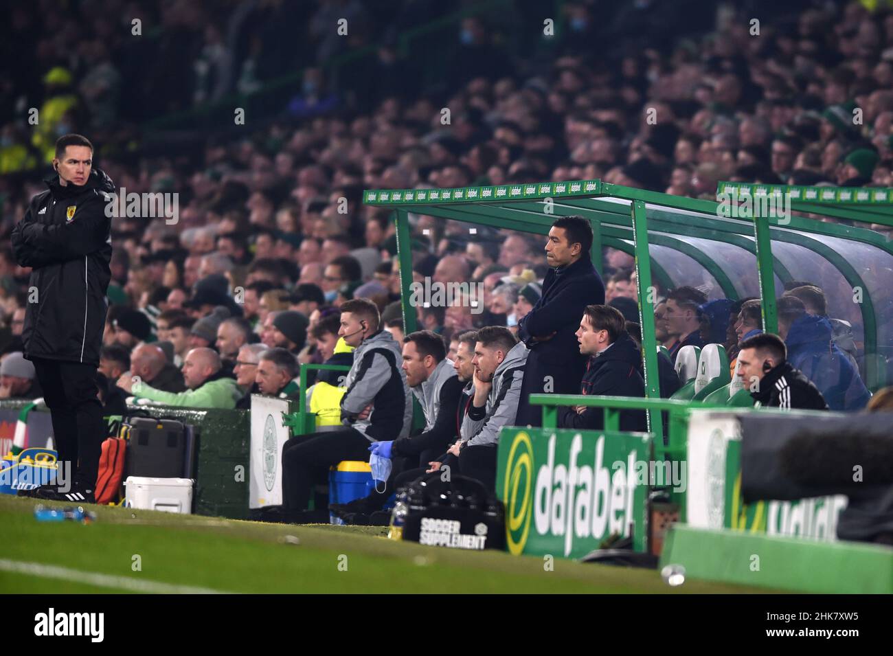 Glasgow, Scotland, 2nd February 2022.  Rangers Manager Giovanni van Bronckhorst retreats to the away dugout  during the cinch Premiership match at Celtic Park, Glasgow. Picture credit should read: Neil Hanna / Sportimage Stock Photo