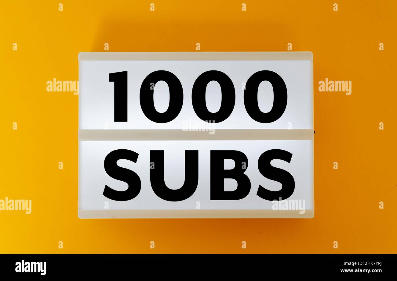 1000 subs number of subscribers on white box and yellow background Stock Photo