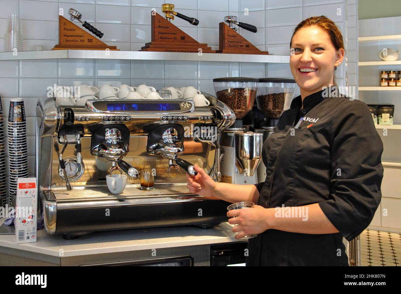 Young female barista in coffee shop, Oslo, Østlandet Region, Norway Stock Photo