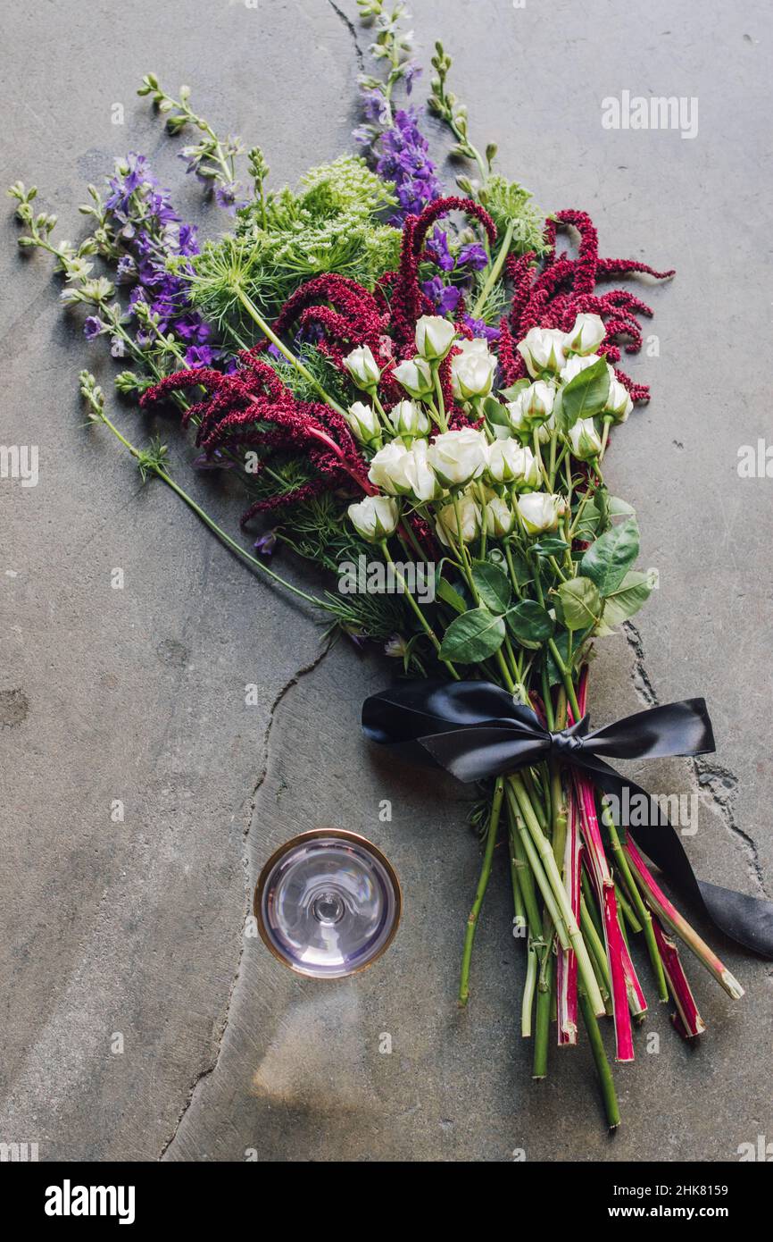 large bouquet of flowers with Arsenic and Old Lace, purple and gold classic cocktail Stock Photo