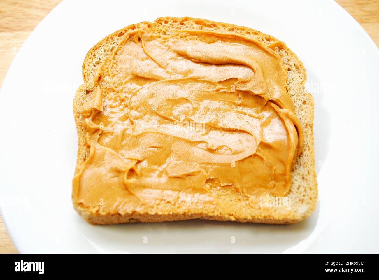 Peanut Butter Spread on Wheat Bread Stock Photo Alamy