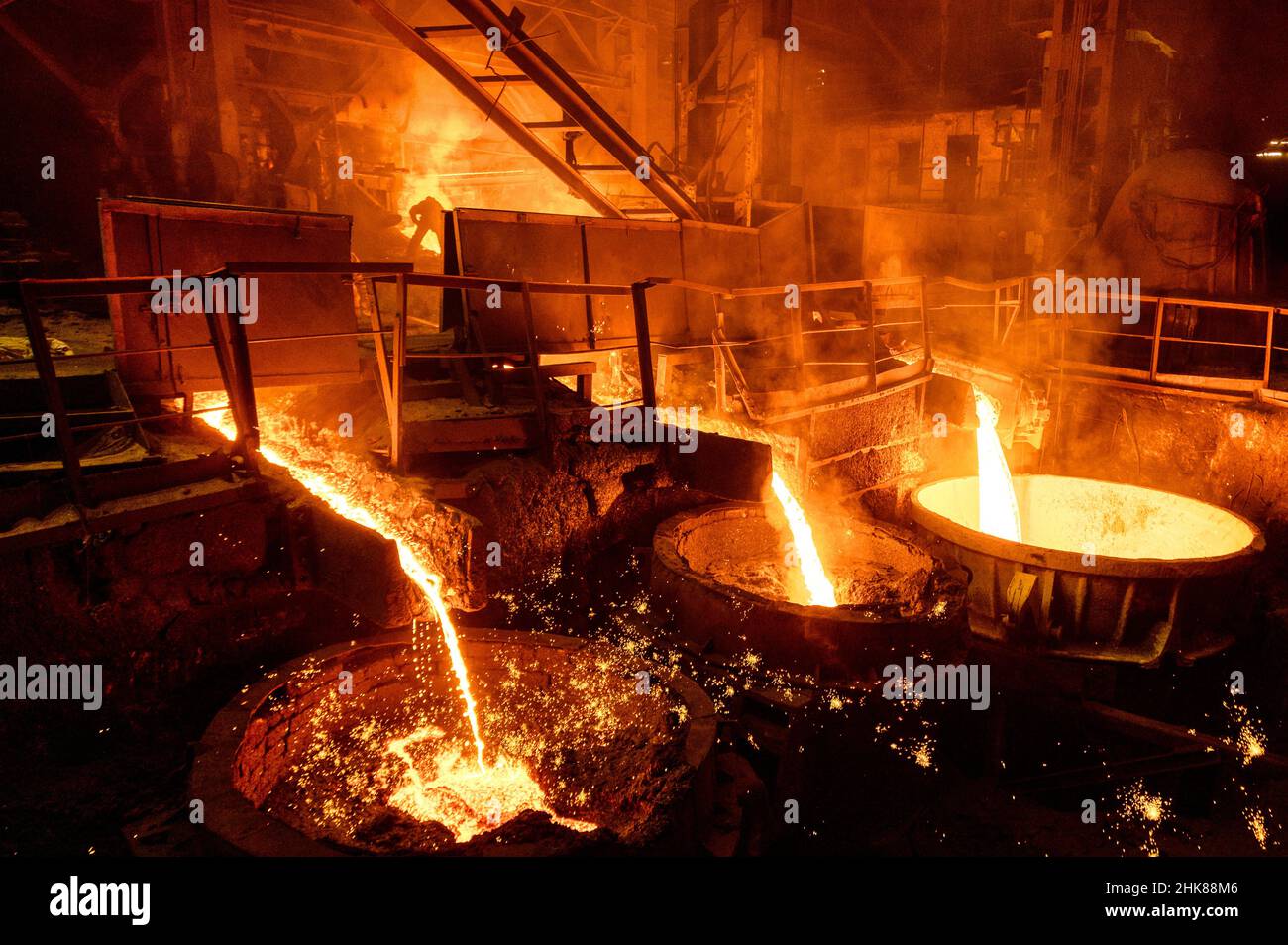 Blast furnace slag and pig iron tapping. Molten metal and slag are