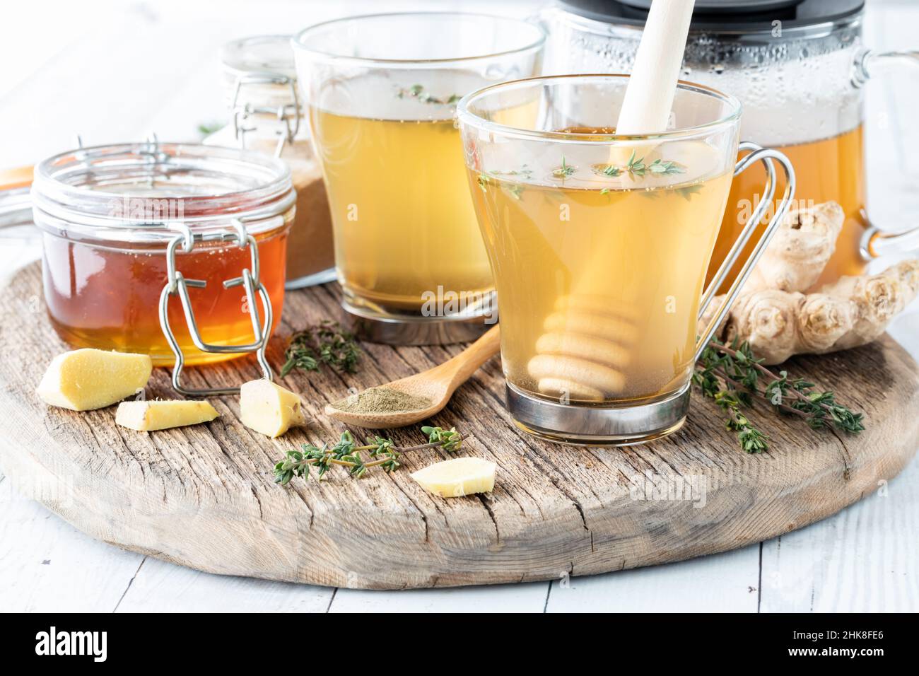 Medicinal elixir tea with ingredients on a rustic wooden board. Stock Photo