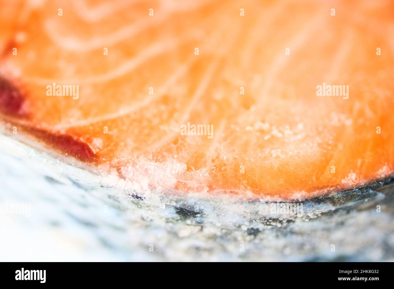 Top view close-up of pink salmon scales with space to copy. A piece of frozen salmon fillet. High quality photo Stock Photo