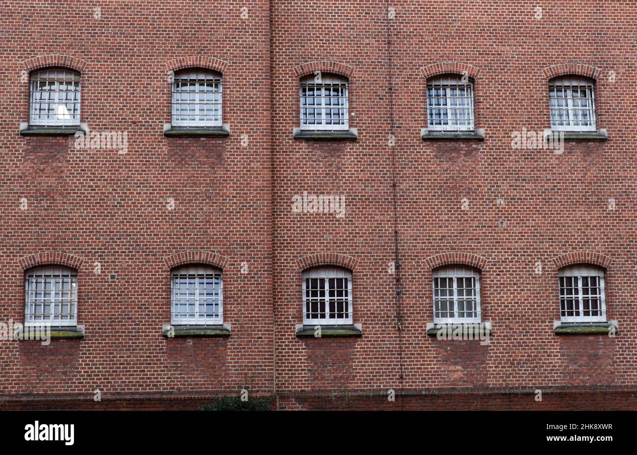 Vechta, Germany. 01st Feb, 2022. Barred windows characterize the facade of the Vechta correctional facility. Artistic activity is an important part of treatment in prison. Since 1993, there have been regularly changing art exhibitions under the name 'ART i. G. - Art in Prison'. Works by imprisoned women are shown as well as those by external artists. (to dpa 'Women in prison in Vechta exhibit their art') Credit: Friso Gentsch/dpa/Alamy Live News Stock Photo
