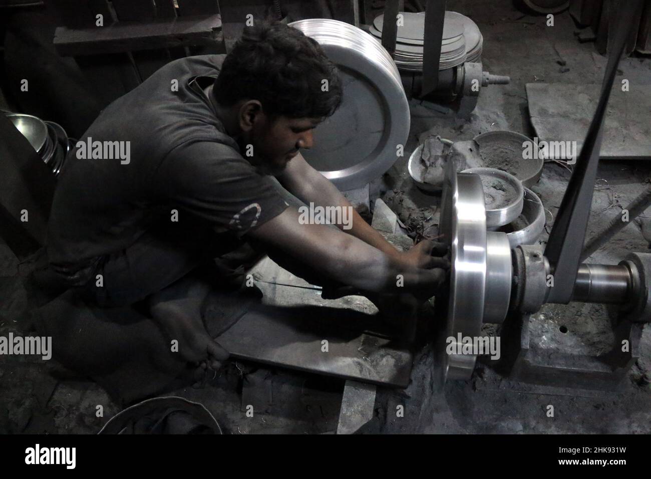 FEBRUARY 02,2022,DHAKA,BANGLADESH Workers make utensils in an unhealthy environment at an