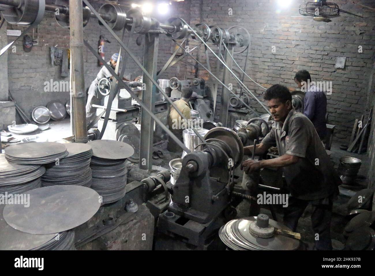 FEBRUARY 02,2022,DHAKA,BANGLADESH Workers make utensils in an unhealthy environment at an