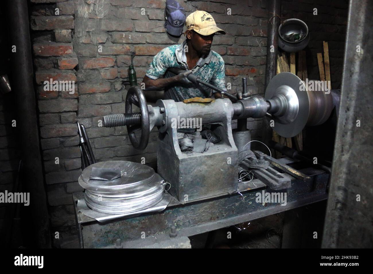 FEBRUARY 02,2022,DHAKA,BANGLADESH Workers make utensils in an unhealthy environment at an
