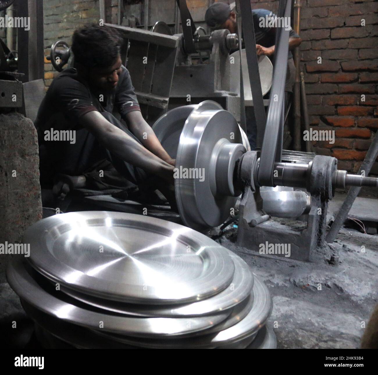 FEBRUARY 02,2022,DHAKA,BANGLADESH Workers make utensils in an unhealthy environment at an