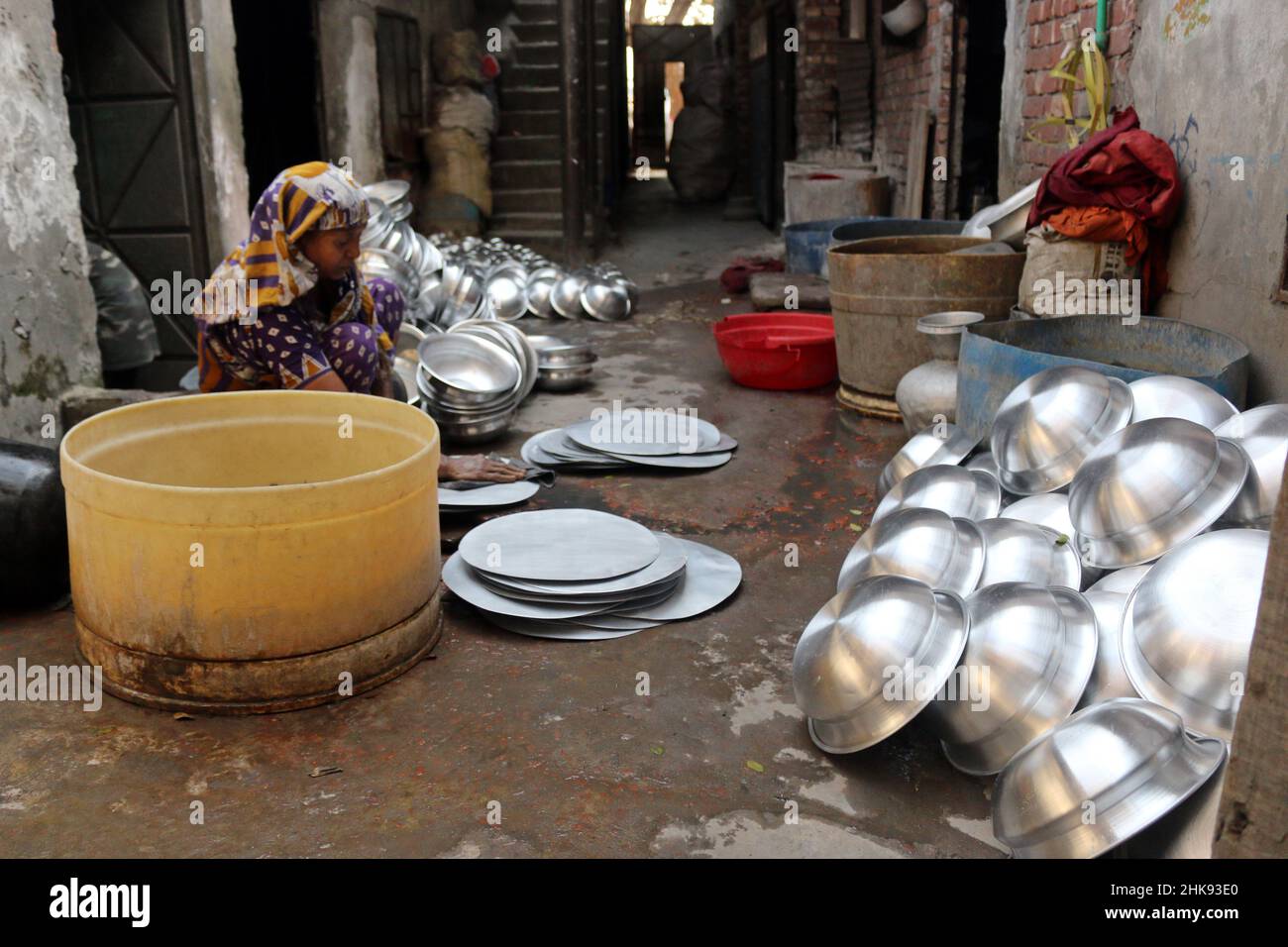 FEBRUARY 02,2022,DHAKA,BANGLADESH Workers make utensils in an unhealthy environment at an