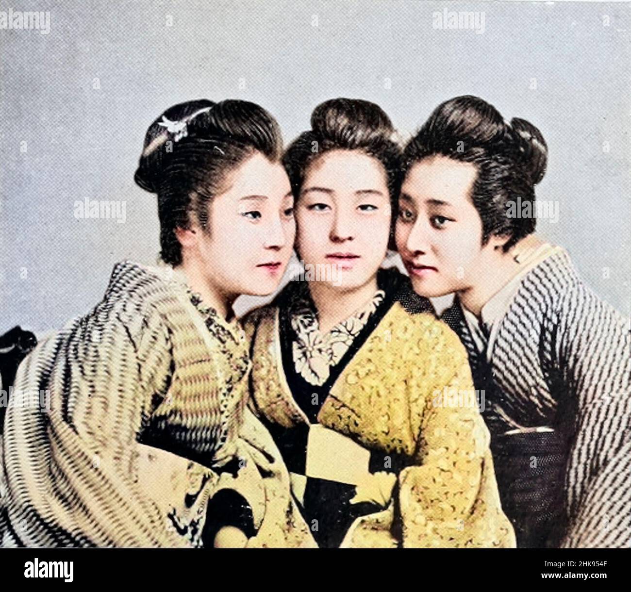 Machine Colourised Three Japanese Girls from the book '  The living races of mankind ' Vol 1 by Henry Neville Hutchinson,, editors John Walter Gregory, and Richard Lydekker, Publisher: London,  Hutchinson & co 1901 Stock Photo